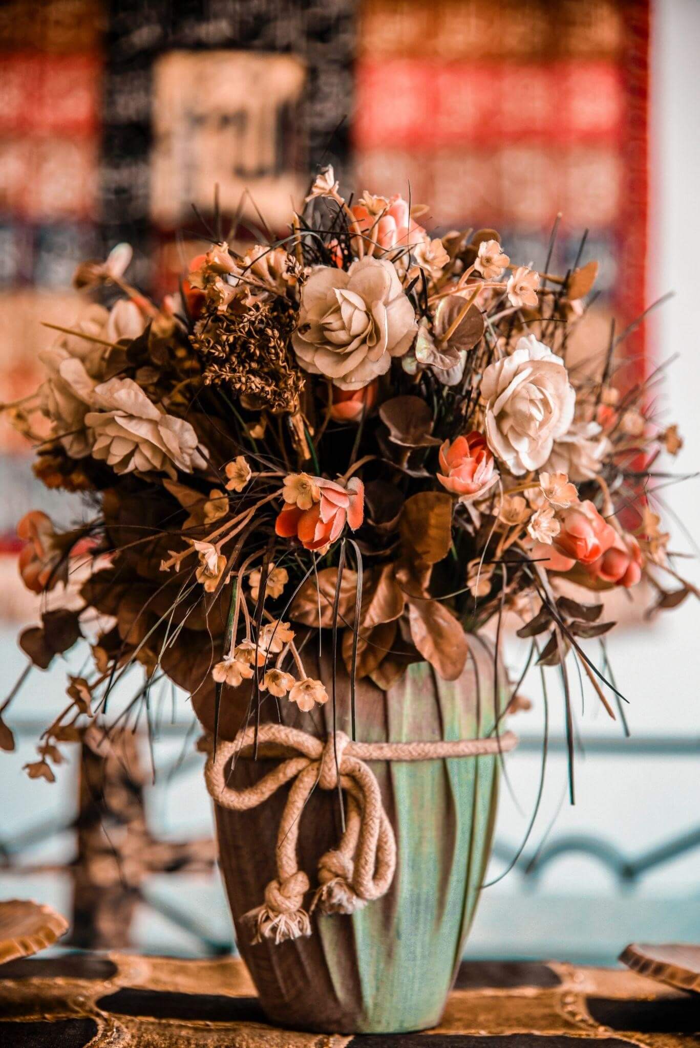 Artificial flower secured in a vase