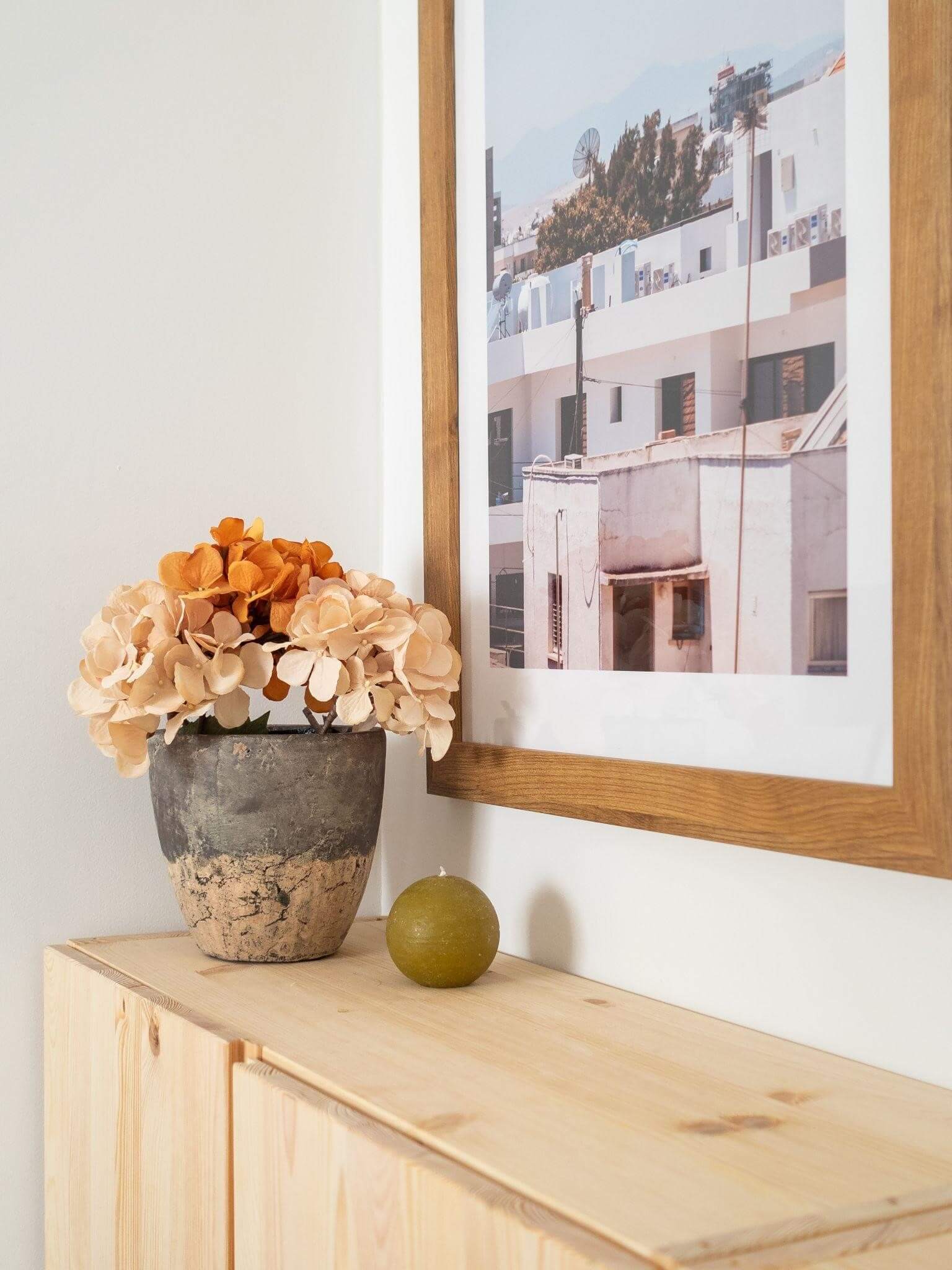  Artificial plant on a wooden shelf